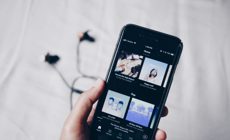 The 12 Spotify Playlists & Podcasts To Help Ease Your Holiday Itch
